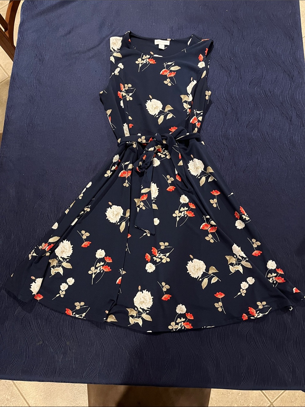 Flowered navy blue dress with tie belt. New without tags